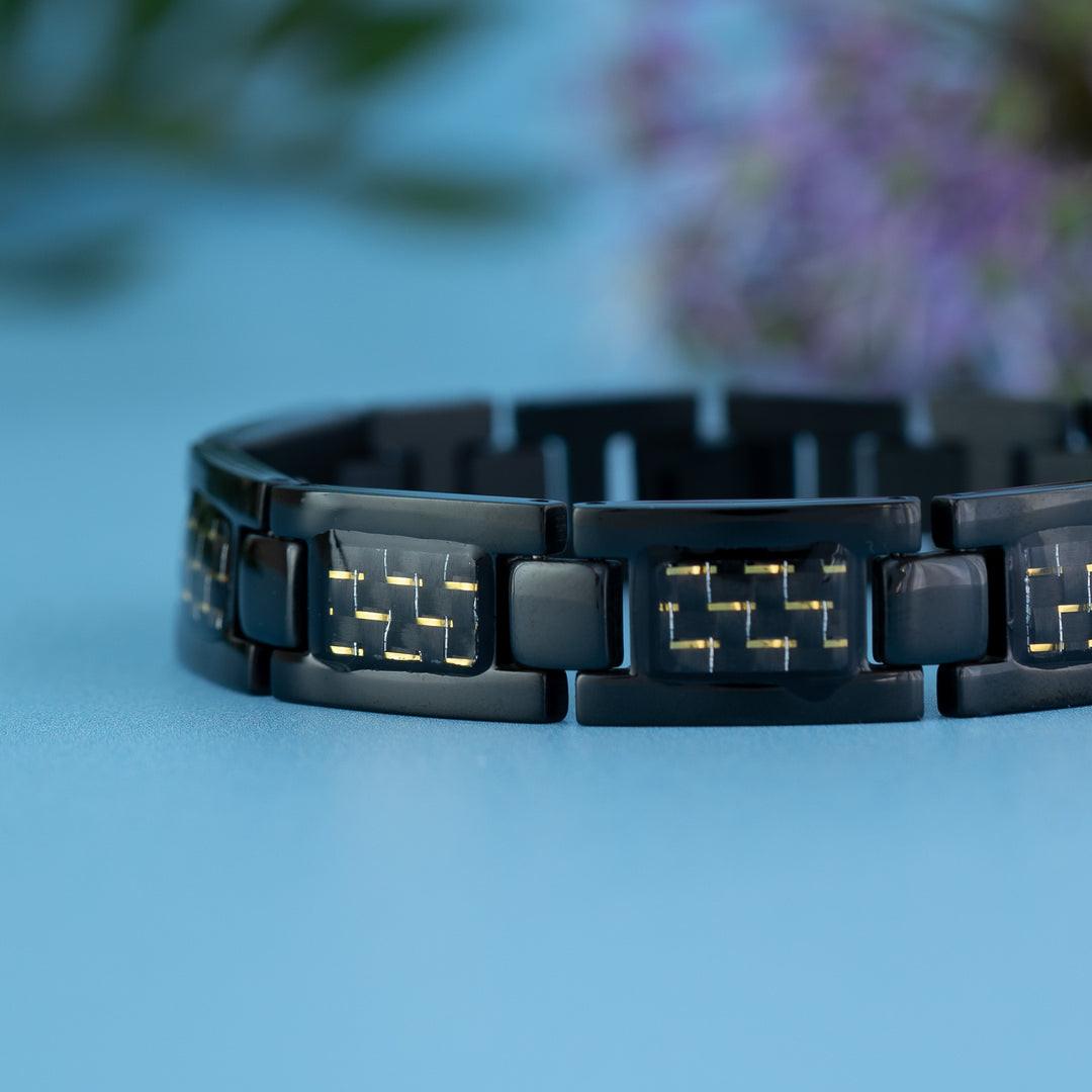 Close up view of the Air 4in1 Magnetic Bracelet from Magnetic Mobility - Mens Black Magnetic bracelet with Yellow designs