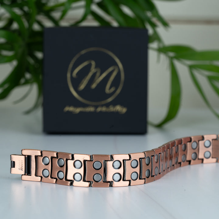 Close-up of the back view of the 15mm Ashe Copper Magnetic Bracelet, showing the double-strength magnets embedded in each link.