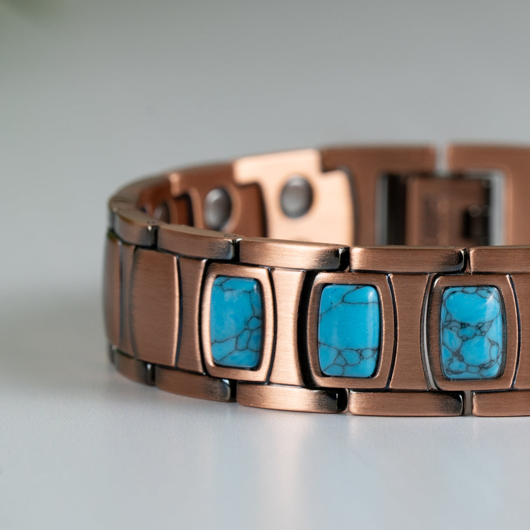 Close-up view of the Asphodel Copper Magnetic Bracelet, focusing on the detailed craftsmanship, copper finish, and vibrant turquoise stones.