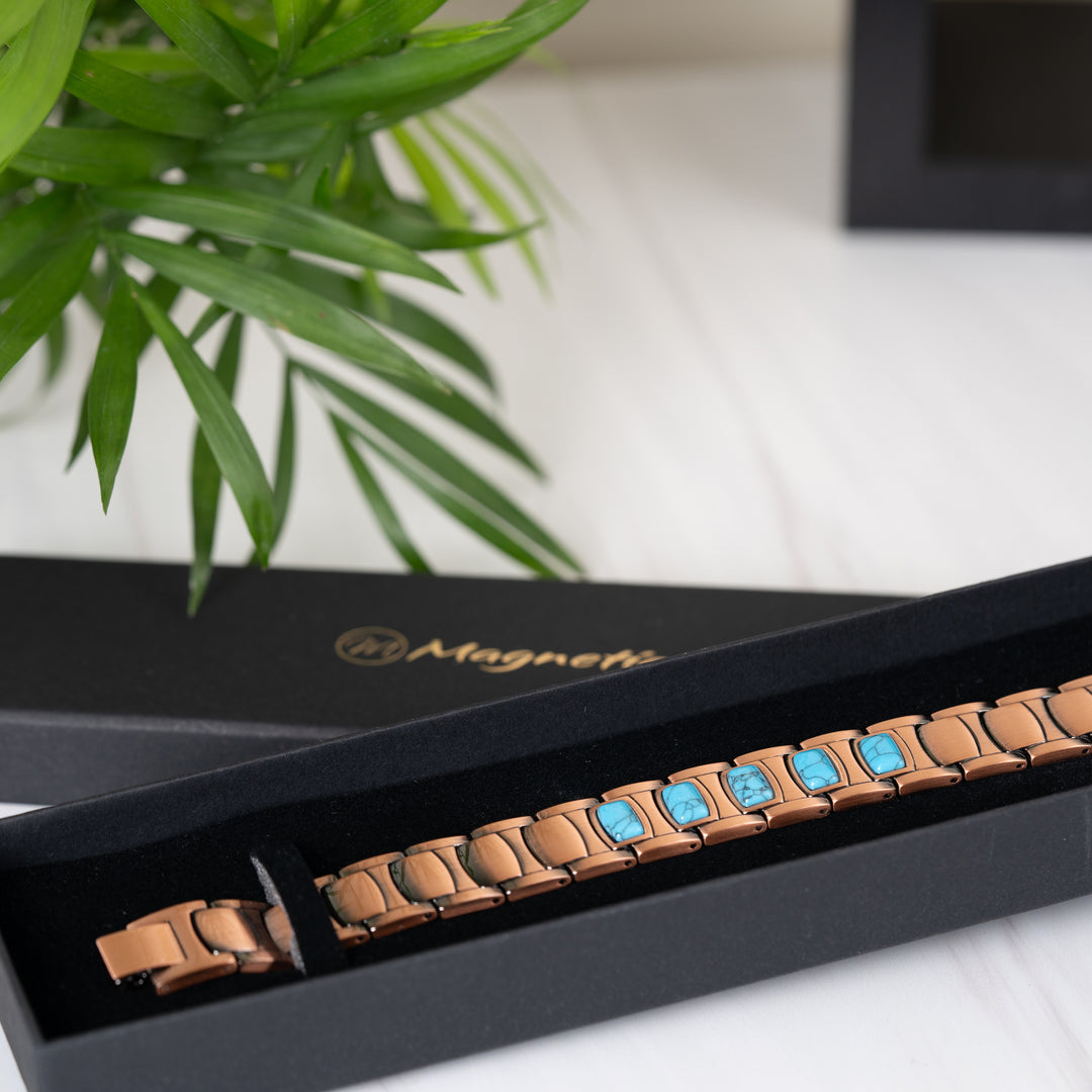 Asphodel Copper Magnetic Bracelet elegantly displayed in a black gift box with the Magnetic Mobility logo, showcasing its turquoise stones and premium copper design.