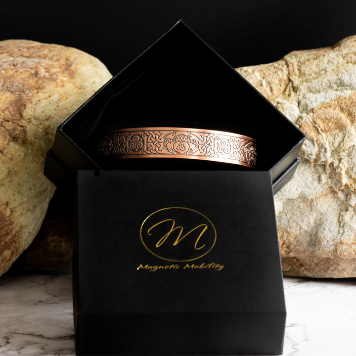 View shows the Claddagh Copper bracelet inside a Black Luxury Eco-friendly jewllery box with the Magnetic Mobility symbol on it.