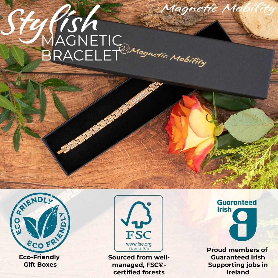 Honesty Dawn - 4in1 Magnetic bracelet with a centerpiece, adorned with two rows of shimmering Swarovski crystals. By Magnetic Mobility. Shown in a black Magnetic Mobility gift box with a rose beside it. Also shows logos of Eco-friendly gift box from FSC paper and members of Guaranteed irish