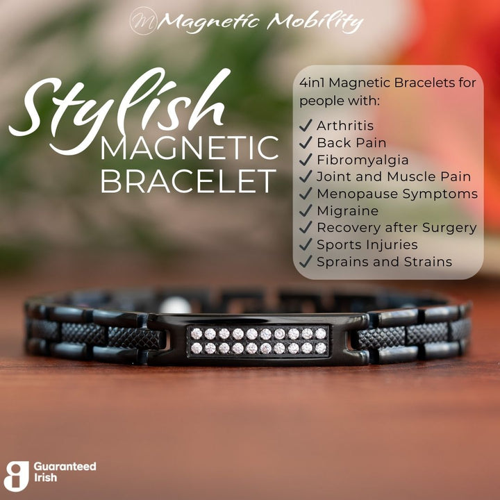 Honesty Night 4in1 Magnetic Bracelet from Magentic Mobility - A black magentic bracelet with a centerpiece, adorned with two rows of shimmering Swarovski crystals. Front view close up - with writing - for people with arthritis, back pain, fibromyalgia, joint and muscle pain, menopause symptoms, migraine, recovery after surgery, sports injuries, sprains and strains.