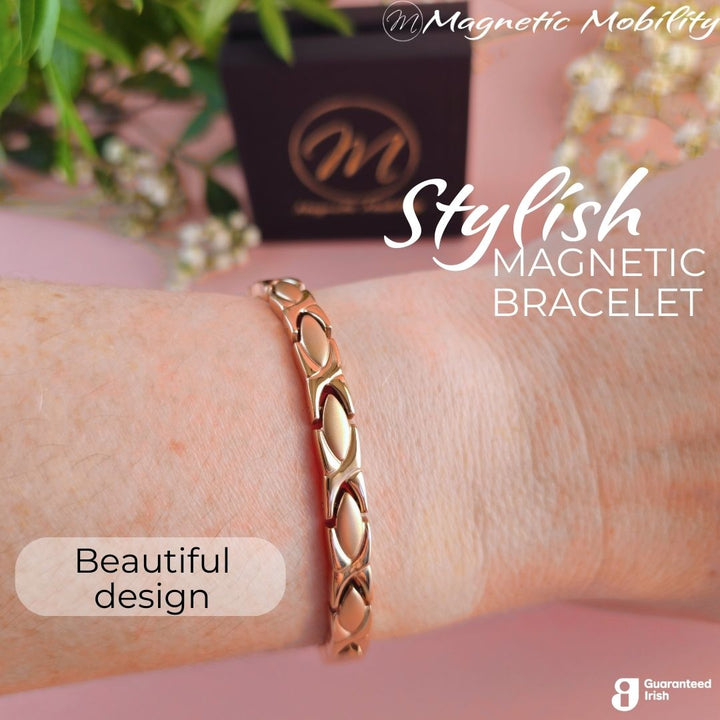 Laurel Dawn - a rose gold 4in1 Magnetic bracelet on a womans wrist.