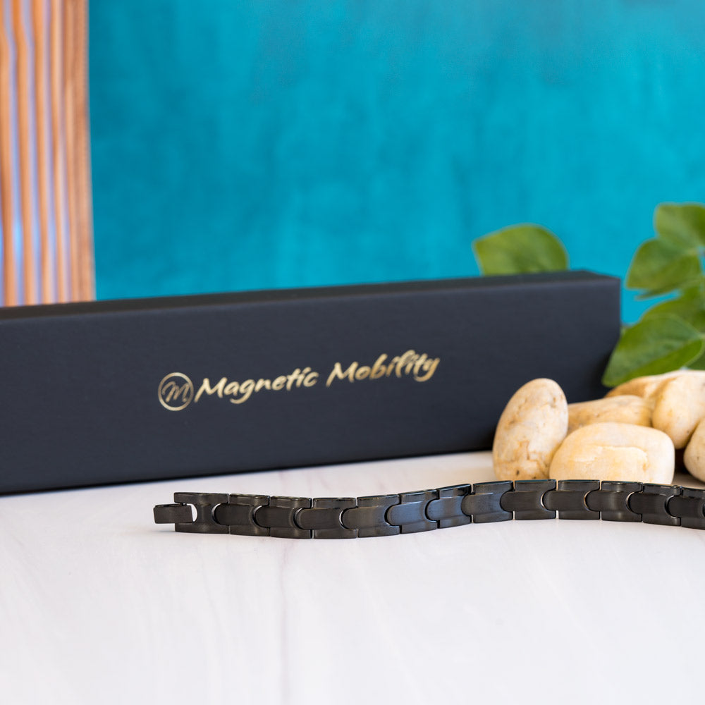 Side view of the Rowan Night Men's Black 4in1 Magnetic Bracelet, revealing its sleek stainless steel construction with interconnected pieces and a captivating black stripe, showcasing a perfect balance of style and sophistication