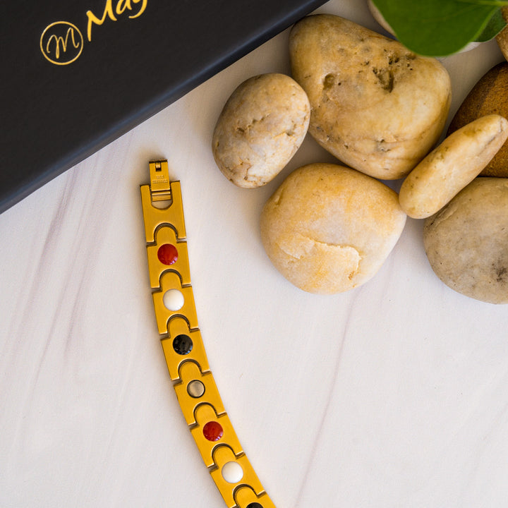 Back view of the gold-plated Rowan Sun Men's 4in1 Magnetic Bracelet, revealing the embedded elements for enhanced wellness. Neodymium magnets, Germanium, Negative ions, and Far Infrared (FIR) components seamlessly integrated into the bracelet's design, promoting potential benefits. A perfect synergy of style and health, offering a fashionable accessory with wellness features