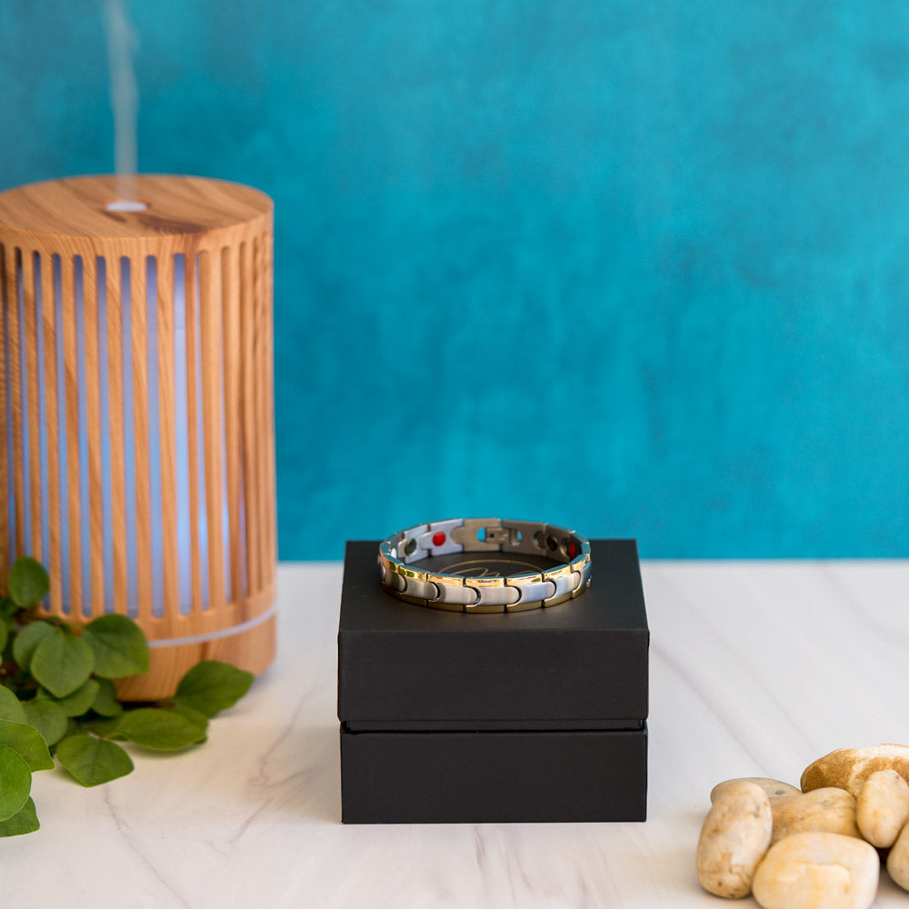 Front view of the Rowan Moon Men's Stainless Steel Bracelet, displaying its sleek design with a silver inlay and a captivating gold stripe