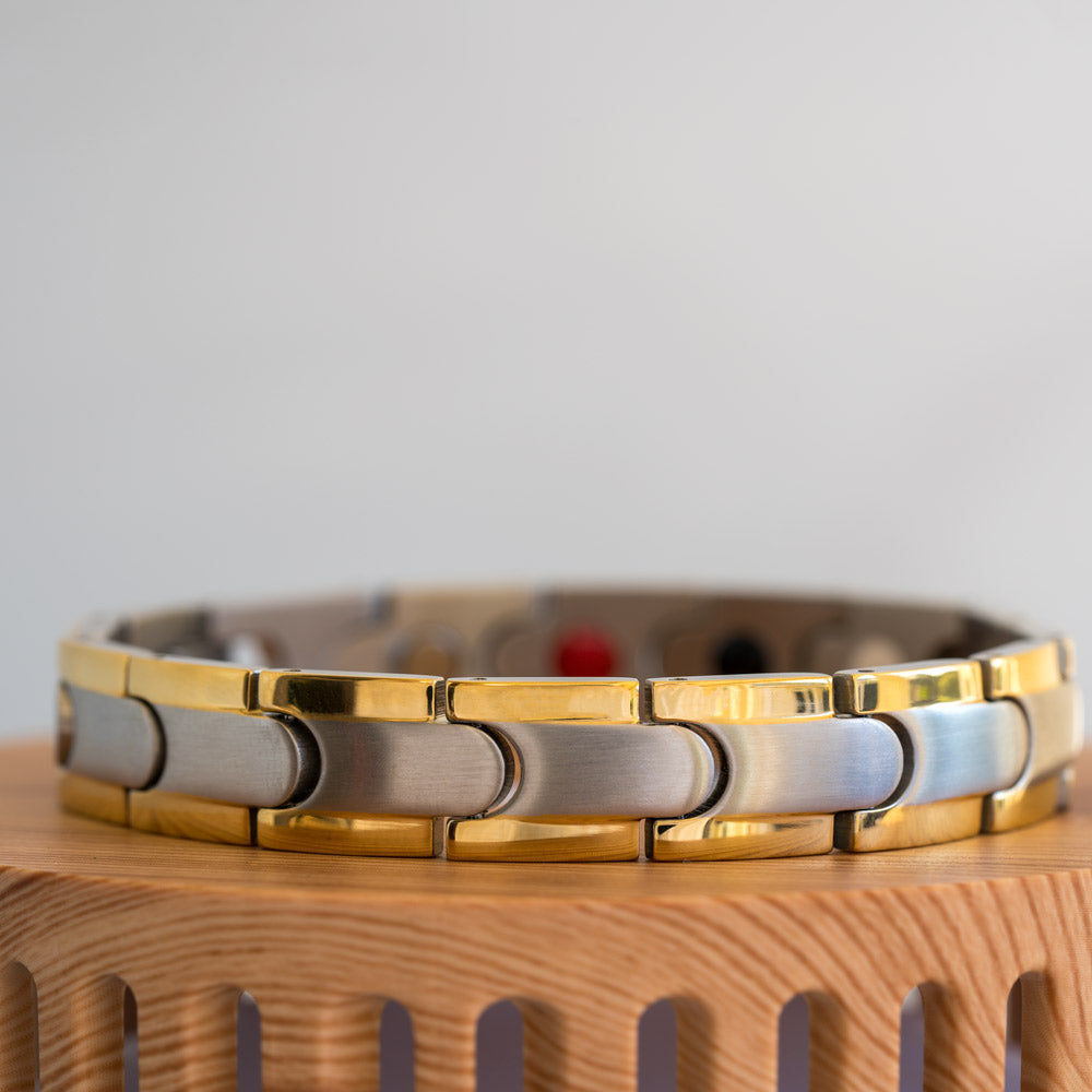 Close-up view of the Rowan Moon Men's Stainless Steel Bracelet, highlighting its intricate silver inlay with a striking gold stripe, creating an elegant contrast.