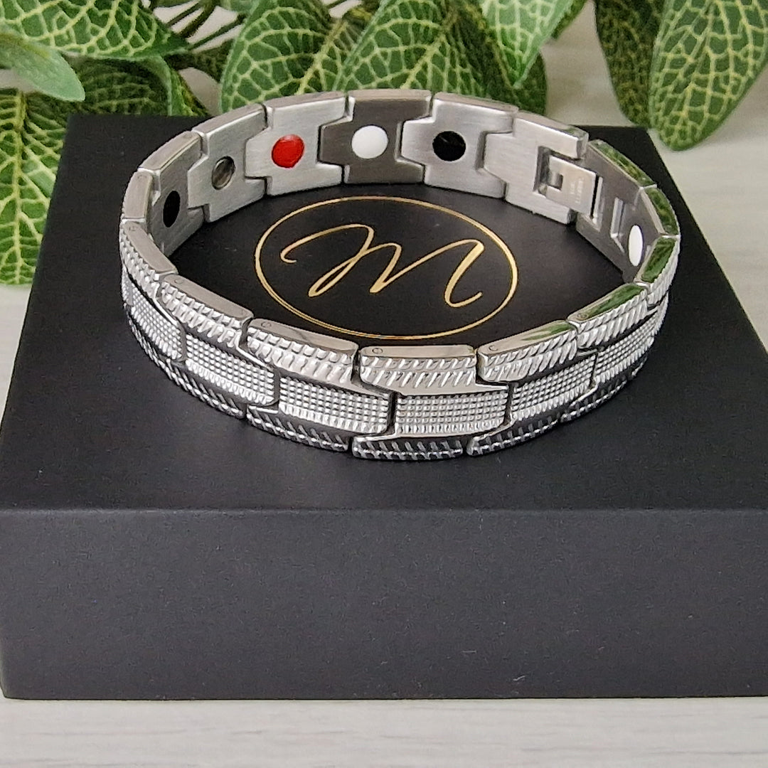 An angled view of Gentian Star Magnetic Bracelet, focusing on its rugged elegance and therapeutic 4in1 elements beneficial for arthritis.