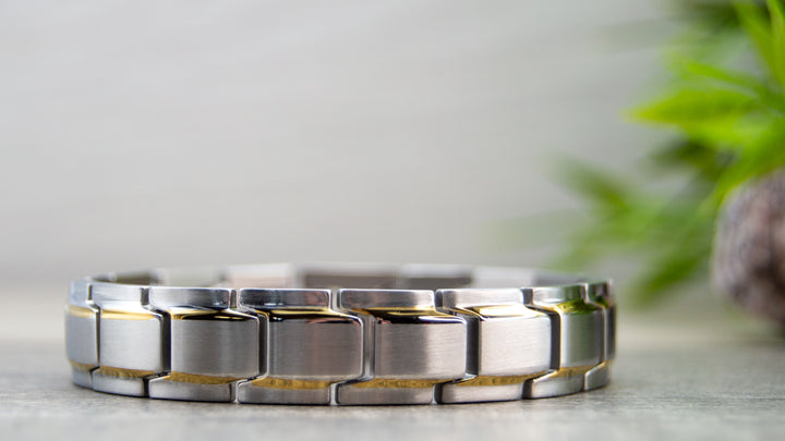 Front view of Alexanders Moon - Mens Magnetic Bracelet - Silver with Gold Stripes.