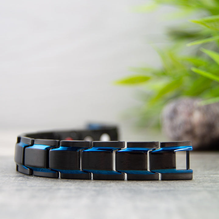 Front view of Alexanders Sky - Mens Magnetic Bracelet - Black with Blue Stripes.