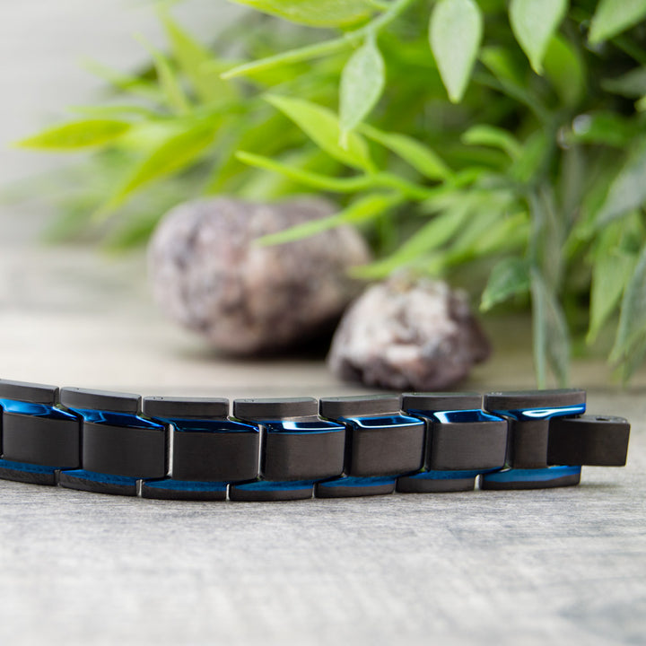 Front view of Alexanders Sky - Mens Magnetic Bracelet - Black with Blue Stripes.
