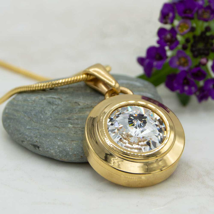 Angelica Sun Magnetic necklace. Front view of the necklace which is a gold plated magnetic necklace with a white Swarovski stone