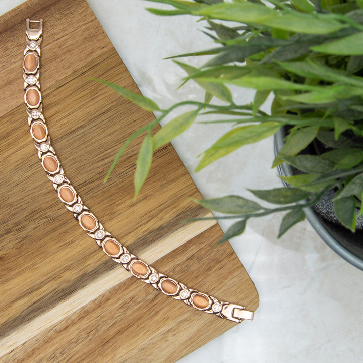 Top view of Willow Dusk - Womens Rose gold coloured magnetic bracelet with opals and white crytals,