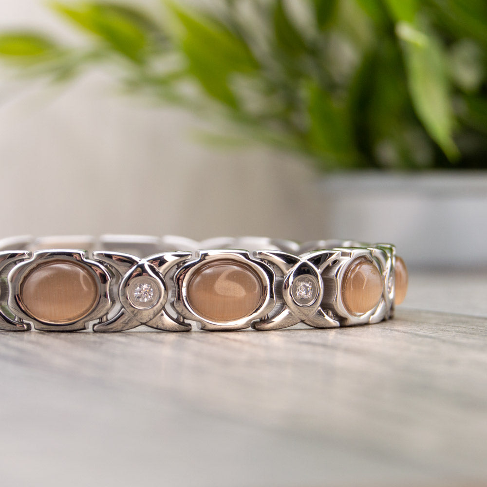 Silver colour Magnetic Bracelet with Opals and white crystals. Contains 4 health elements for women with arthritis, back pain, migraine etc.