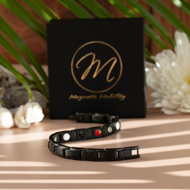 Apia Night 4in1 Magnetic Bracelet from Magnetic Mobility - Thin black magnetic bracelet - snake lay out - gift box and flowers