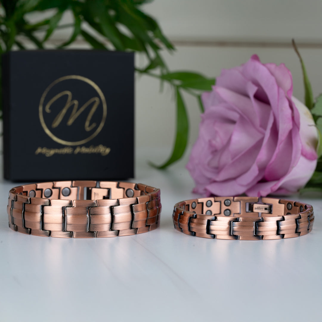 Ashe Copper Magnetic Bracelets - 9mm slim and 15mm wide styles - placed side by side, highlighting their double-strength magnets and smooth copper finishes