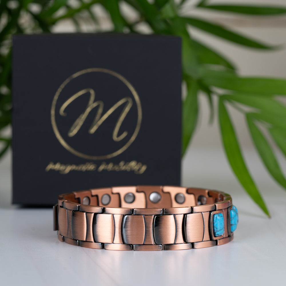 Side view of the Asphodel Copper Magnetic Bracelet, highlighting its 14mm thick band, elegant copper links, and turquoise stones.