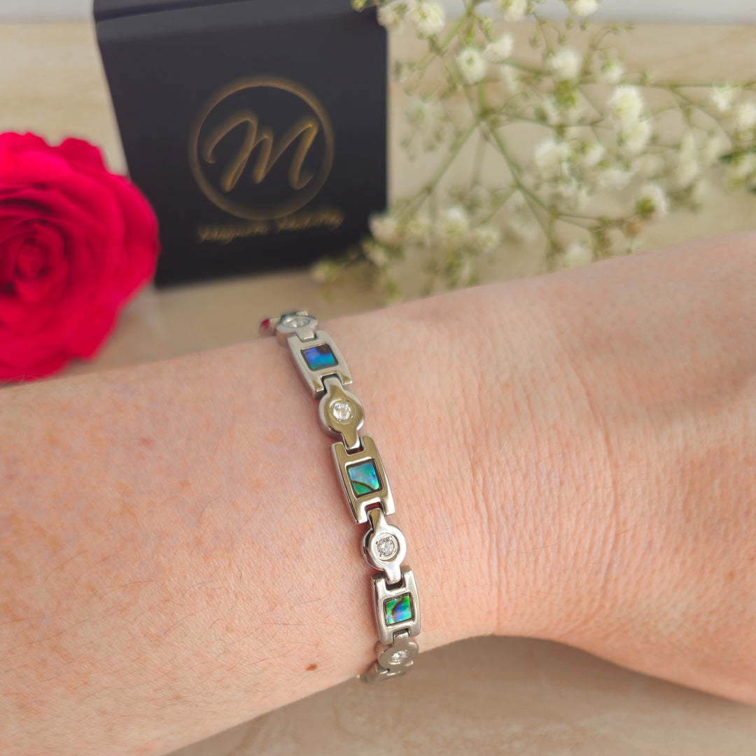 Avens Star - Womens 4in1 Magnetic Bracelet from Magentic Mobility - Silver coloured with pearlestant designs  - on wrist