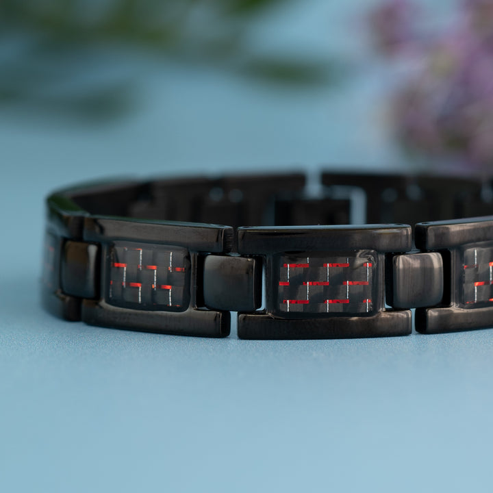 Close up view of Fire 4in1 Magnetic Bracelet from Magnetic Mobility - Mens Black Magnetic bracelet with Red designs