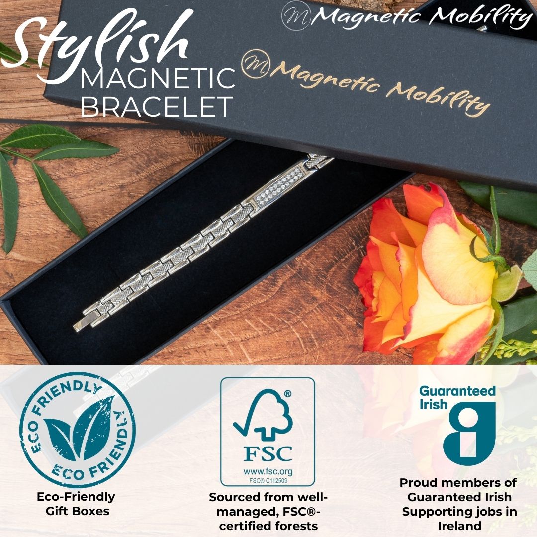 Silver 4in1 Magnetic bracelet from agnetic Mobility with a centerpiece, adorned with two rows of shimmering Swarovski crystals. Shown in a black Magngetic Mobility gift box with logos showing Eco-friendly and FSC paper used. Also shows Guaranteed irish logo