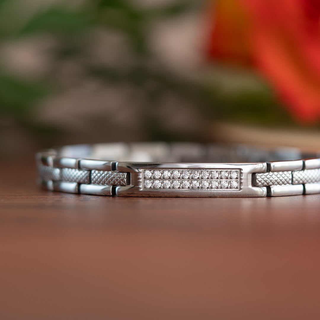 Silver 4in1 Magnetic bracelet from agnetic Mobility with a centerpiece, adorned with two rows of shimmering Swarovski crystals. Close up view