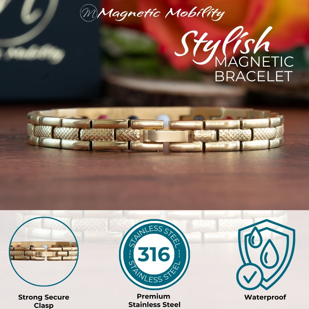 Gold 4in1 Magnetic Bracelet from Magentic Mobility with a centerpiece, adorned with two rows of shimmering Swarovski crystals. Close up view of the clasp. Logos showing premium stainless steel and waterprrof. 