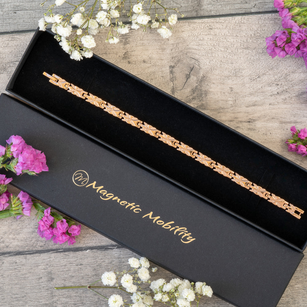 Meadowsweet Dawn 4in1 Magnetic Bracelet in a premium black gift box by Magnetic Mobility, highlighting its rose gold butterfly design.