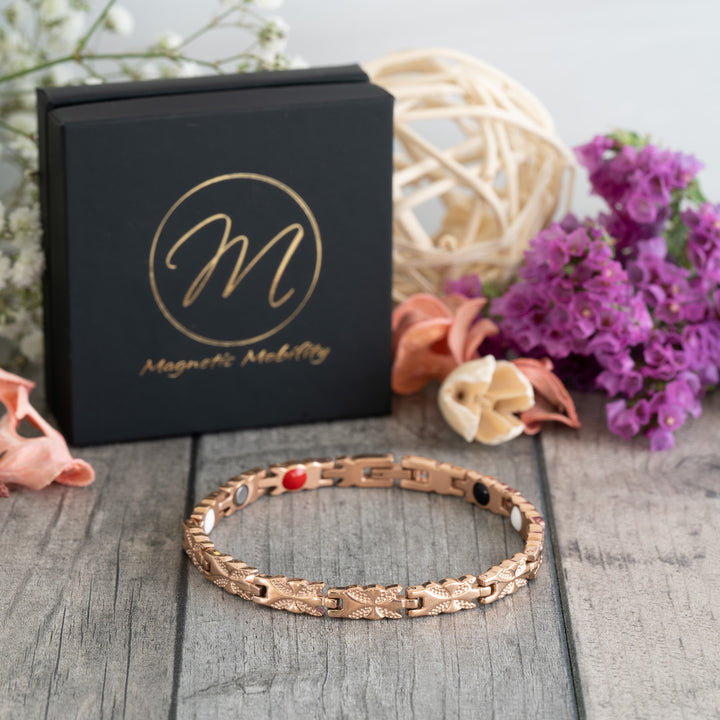 Meadowsweet Dawn 4in1 Magnetic Bracelet displayed at a 45-degree angle, showcasing its delicate rose gold butterfly design and stylish finish.