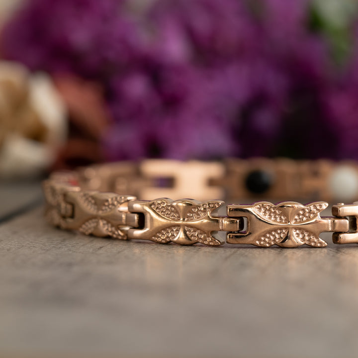 Close-up of the Meadowsweet Dawn 4in1 Magnetic Bracelet, showcasing its elegant rose gold butterfly design for arthritis pain relief and joint support.