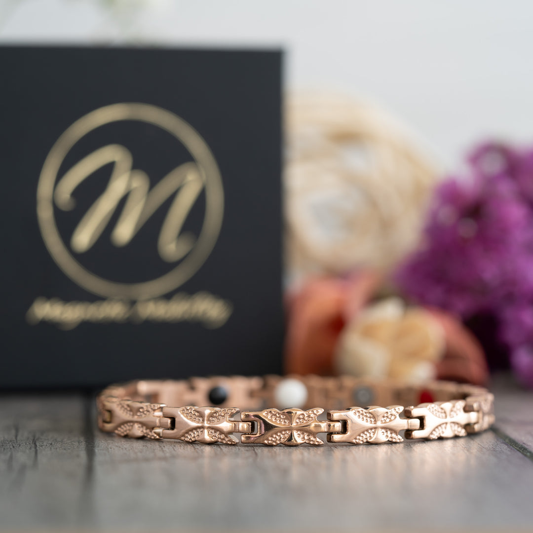 Front view of the Meadowsweet Dawn 4in1 Magnetic Bracelet by Magnetic Mobility, featuring a stylish rose gold butterfly design with health benefits for arthritis relief.