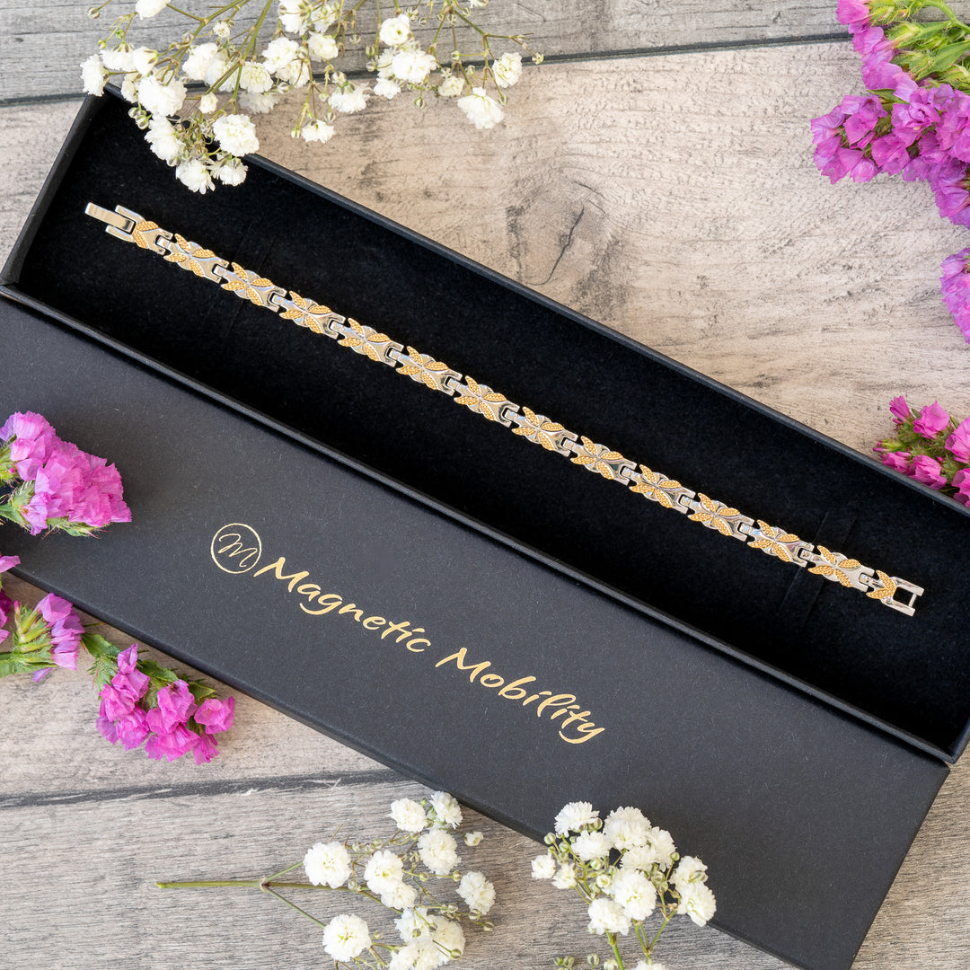 Meadowsweet Moon 4in1 Magnetic Bracelet in an elegant Magnetic Mobility gift box. Silver and gold butterfly design bracelet combining style and therapeutic relief with Neodymium magnets, FIR elements, Germanium, and Negative Ions. Perfect gift for arthritis pain relief and joint wellness.