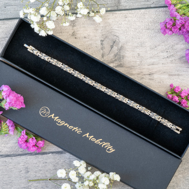 Meadowsweet Night 4in1 Magnetic Bracelet in a premium black gift box by Magnetic Mobility, showcasing its silver and black butterfly design.