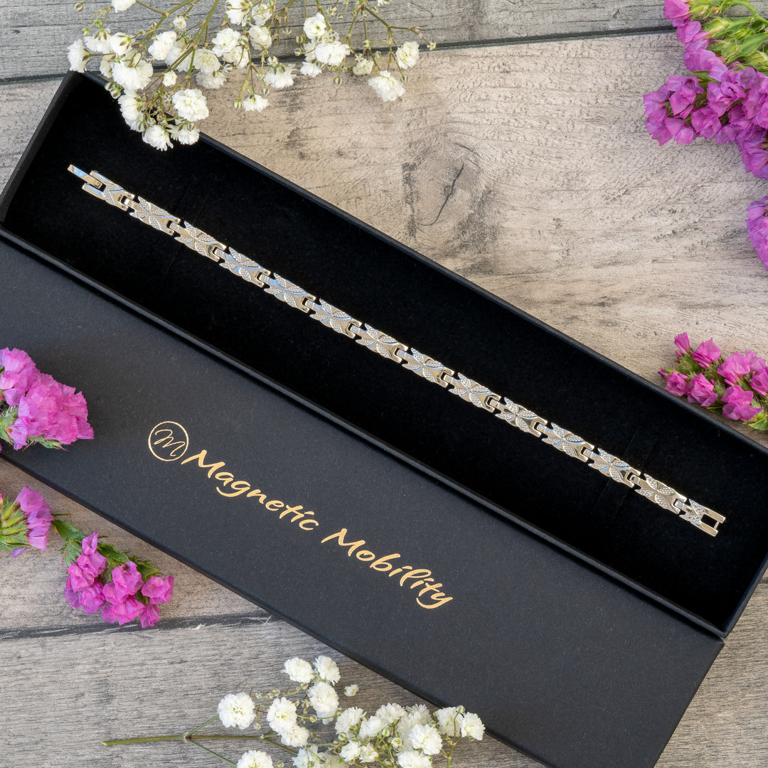 Meadowsweet Star 4in1 Magnetic Bracelet in an elegant Magnetic Mobility gift box. Silver butterfly design bracelet combining style and therapeutic relief with Neodymium magnets, FIR elements, Germanium, and Negative Ions. Perfect gift for arthritis pain relief and joint health.