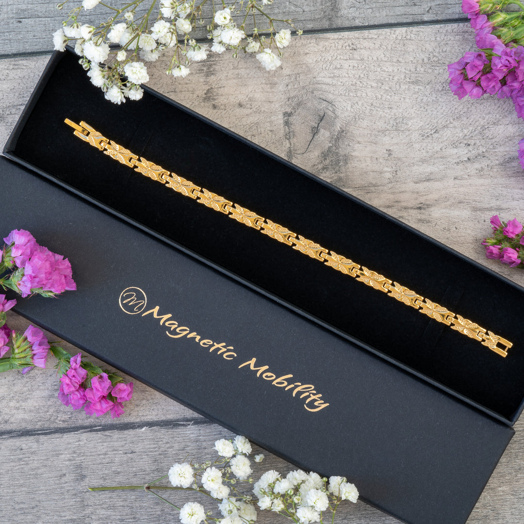 Meadowsweet Sun 4in1 Magnetic Bracelet in a black gift box by Magnetic Mobility, highlighting its elegant gold butterfly design.