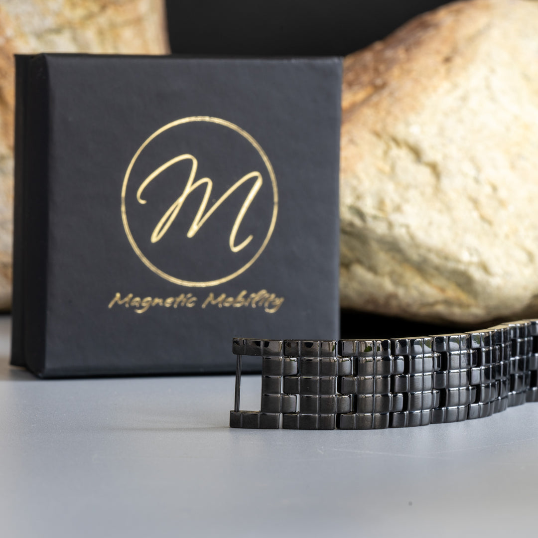 Side View of Double Row Magnetic Bracelet by Magnetic Mobility, with Signature Logo Box in the Background and Natural Stone Detailing
