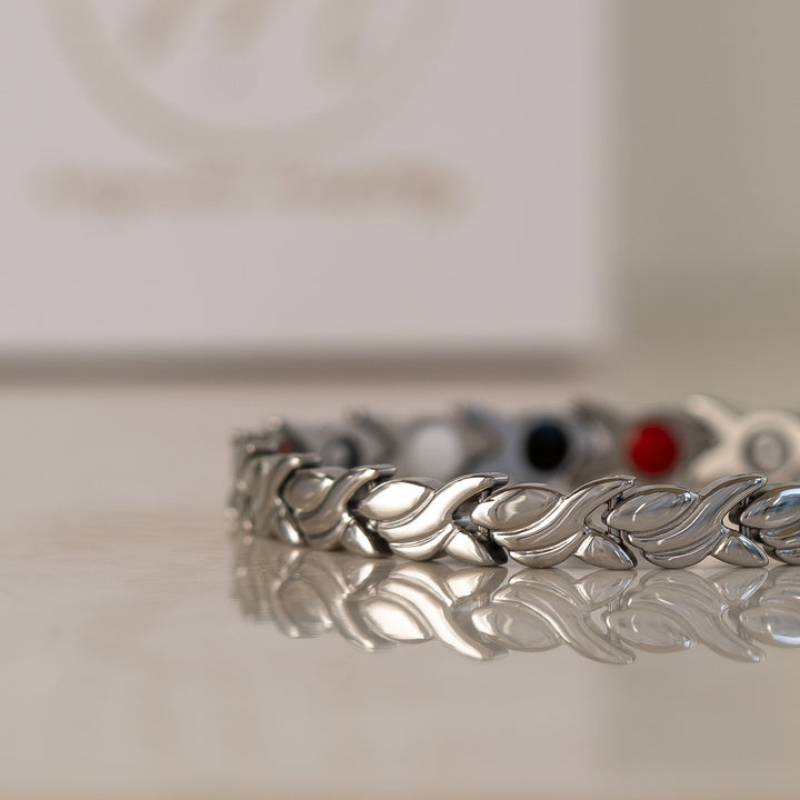 Intricate close-up of the Virginia Star 4in1 Magnetic Bracelet's links and therapeutic elements in silver, designed to aid arthritis and enhance wellness.