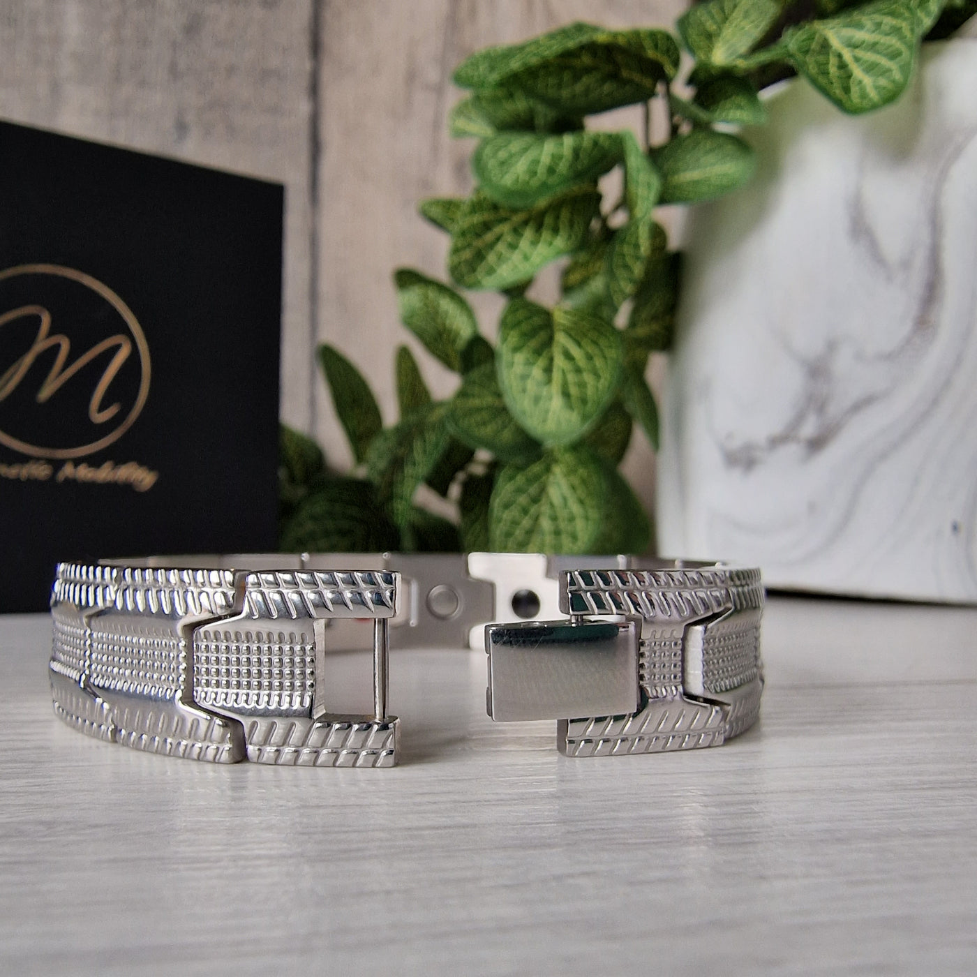 Gentian Star 4in1 Magnetic Bracelet in Silver plated Stainless Steel with a distinctive tire-tread design for arthritis relief. Shows the strong clasp. 