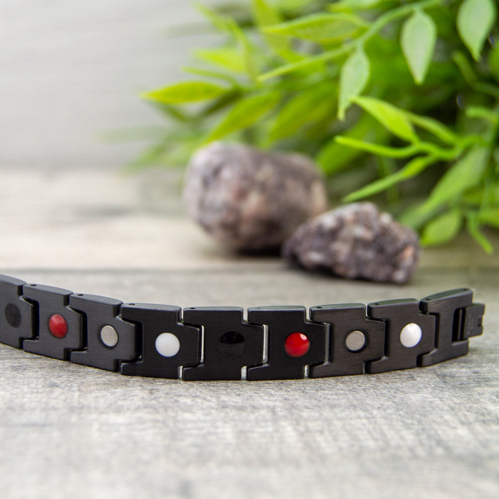 Back view of Alexander Dawn Magnetic Bracelet showing the 4 health elements: Negative ions, Far Infrared, Germanium and Magnets. 