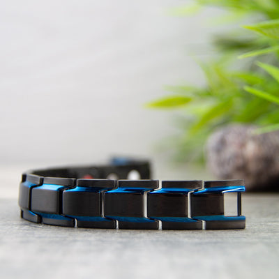 Front view of Alexanders Sky - Mens Magnetic Bracelet - Black with Blue Stripes. 