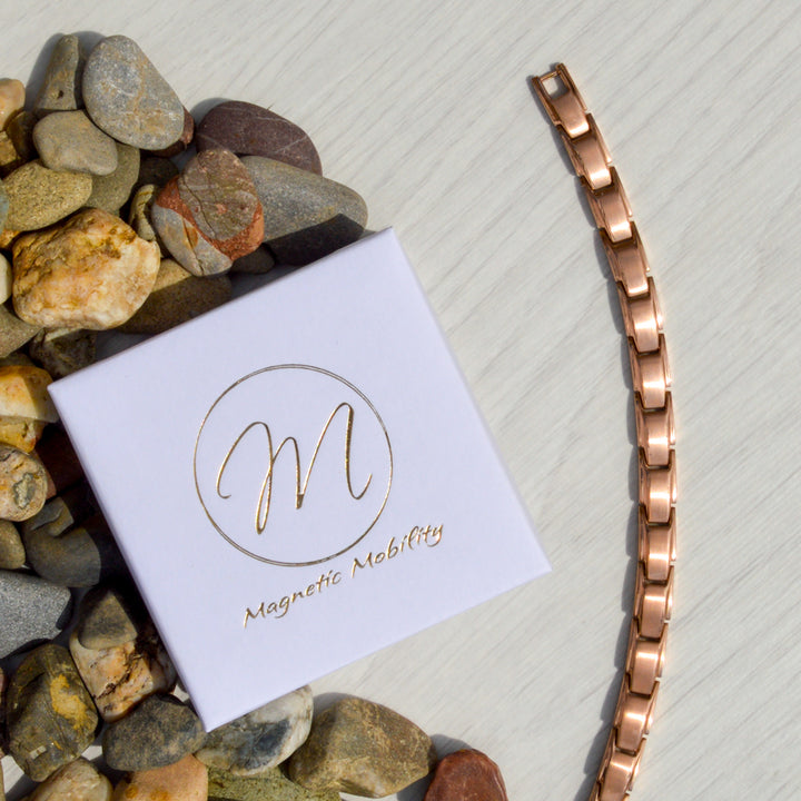 Top view of Apia Dawn rose gold plated stainless steel magnetic bracelet with 4in1 elements on the back, perfect for arthritis and back pain relief.