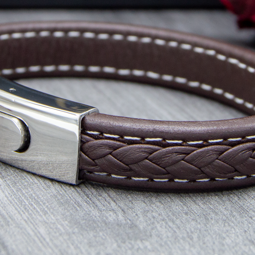 Close up view of the braidin on our brown leahter bracelet with magnets