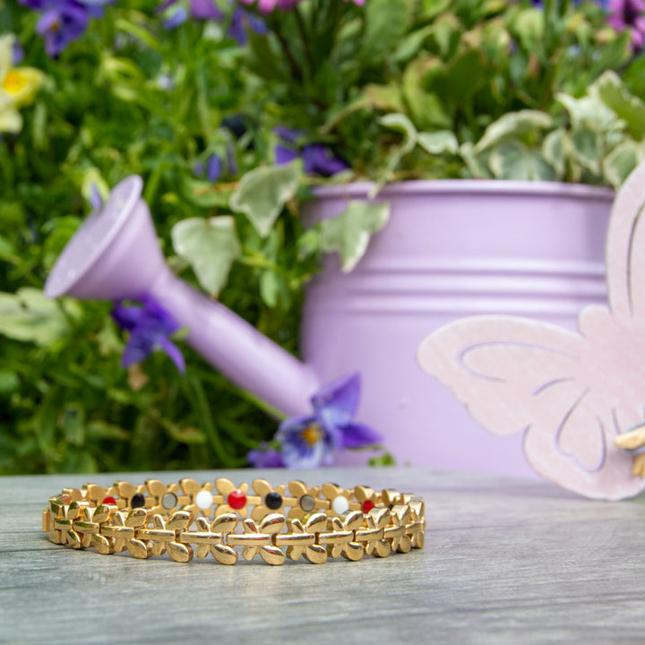 45 degree view of Buddleia Summer Magnetic Bracelet in Gold with butterfly designs