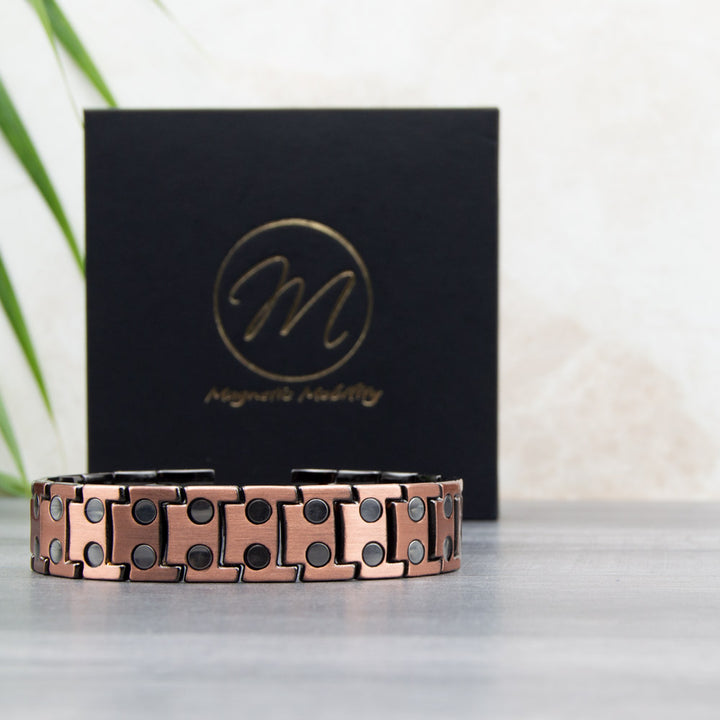 View of the double row of magnets on Charlock Mens Copper Bracelet with Gift box in the background