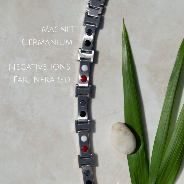Top-down view of Illyrian Dawn Magnetic Bracelet’s back, displaying the 4in1 elements - Neodymium magnets, Germanium, Negative Ions, and FIR.
