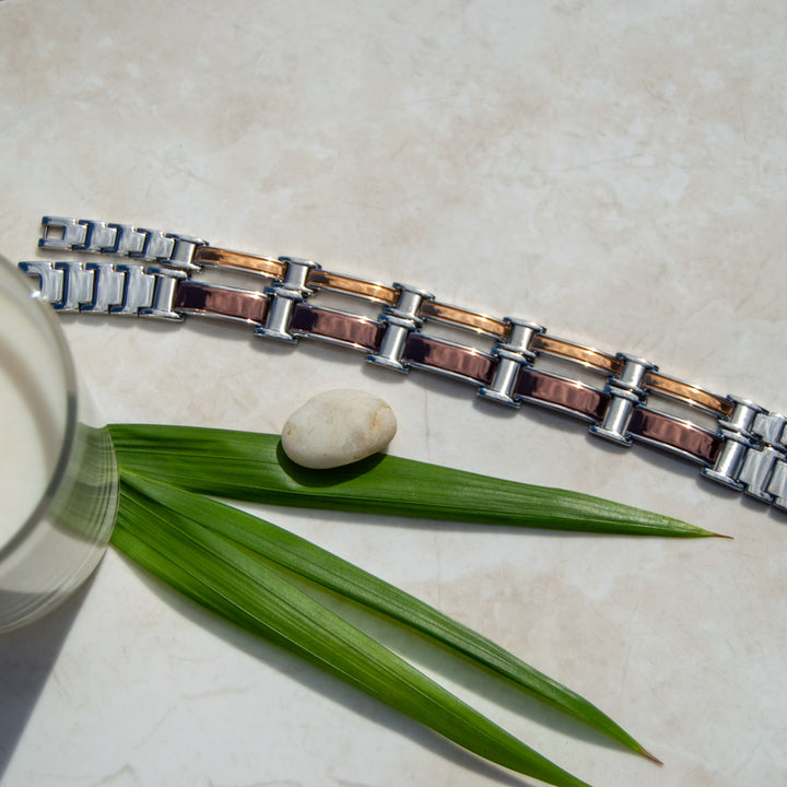 Top view of Illyrian Dawn Magnetic Bracelet’s metallic beige-brown pattern in Silver-plated Stainless Steel, an accessory for the discerning individual. Available in thick and thin styles