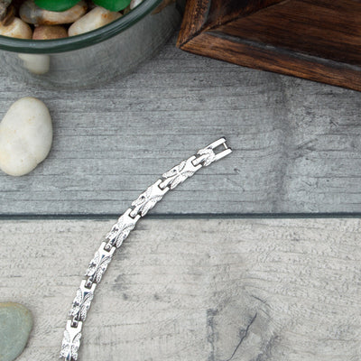 Top view of Meadosweet Moon - Silver  Coloured Women's Magnetic Bracelet with Butterfly type designs. 