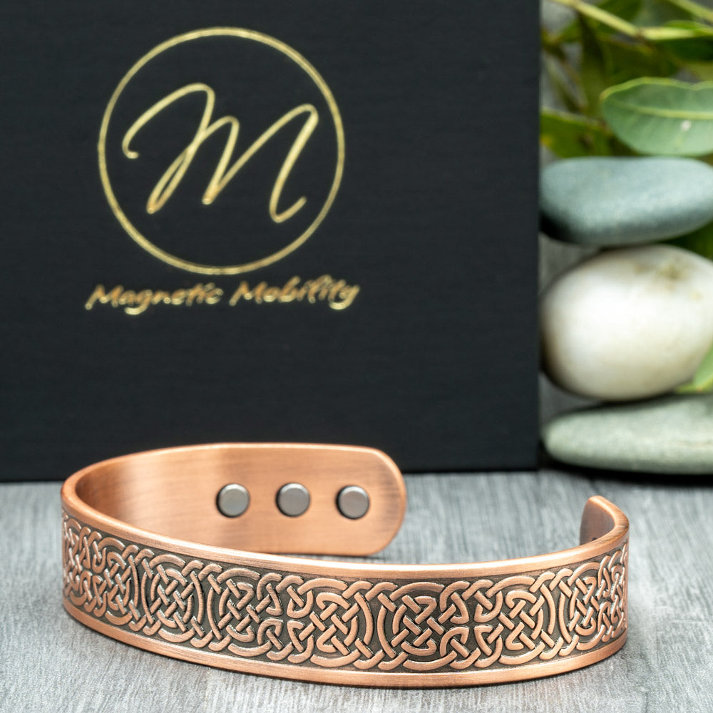 Side view of Privet copper bracelet - showing the celtic design and the neodymium magnets