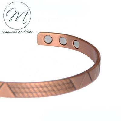 Front view - Geometric designs on a Copper bracelet. Contains  99.9% pure Copper,  and 6 x 3000 gauss Neodymium Magnets