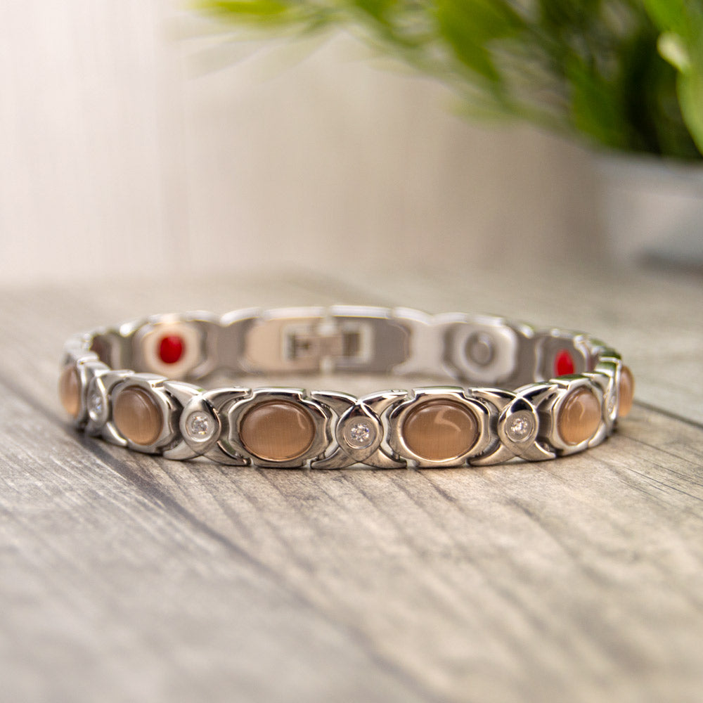 Silver Stainless steel Magnetic bracelet with opals and white crystal. Magnetic bracelet for women with 4 health elements in the back. The Health elements are great fro arthrits, migraine, back pain etc